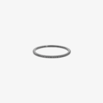 Minimalist fine white gold wedding band with diamond detail by Suïssa Joïers, elegant and modern design.