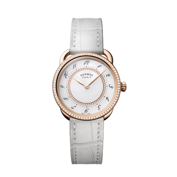 Montre luxe Hermès Arceau Diamonds avec diamants et bracelet blanc.