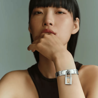 Hermès Kelly watch with golden dial and steel bracelet 16 mm