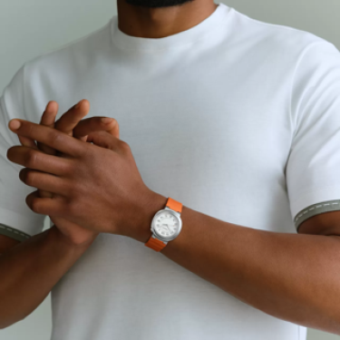 Hermès Cut 36 mm steel opaline dial orange rubber